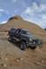 1991 Ford Bronco - This 1991 Ford Bronco navigates a challenging off-road course in a desert environment.