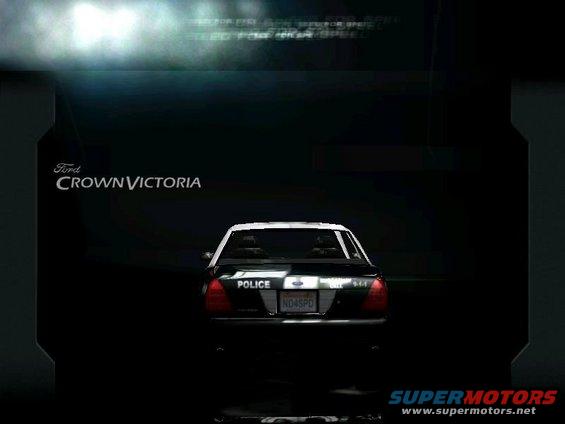 Rear view of a black Ford Crown Victoria police car with a white roof. License plate reads ND4SPD