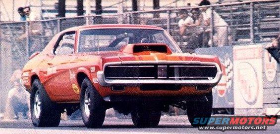 Orange 1968 Mercury Cougar drag car with a hood scoop, front view