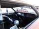 1968 Mercury Cougar - The interior of a 1968 Mercury Cougar is shown, a racing helmet and a glimpse of another vehicle outside.