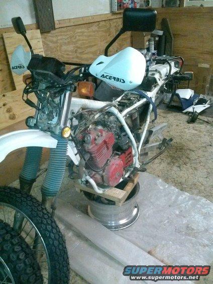 0531170325.jpg My spare truck rim serves and a great base for the wooden block to hold the bike up.  High Tech bike lift and stand.  I use nothing but the finest tools for the job.