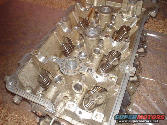 dsc00879.jpg SVT heads being dissasembled. The Rocker arms and cams are removed.