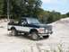 1994 Ford Bronco - This two-tone Ford Bronco is seen from a three-quarter front angle on a construction site.