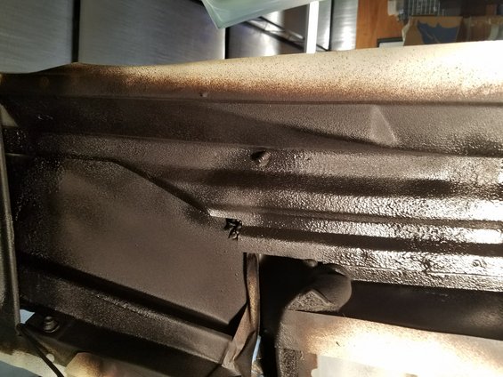 Underbody of vehicle with dark protective coating
