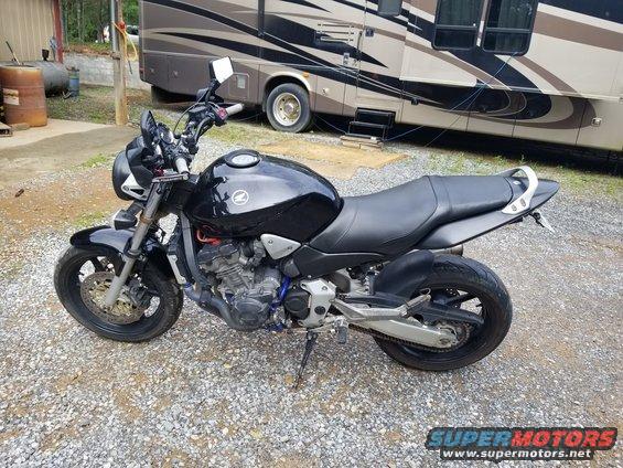 Black 2005 Honda CB9000 motorcycle parked on gravel, side view
