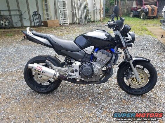 Black motorcycle side view with Yoshimura exhaust