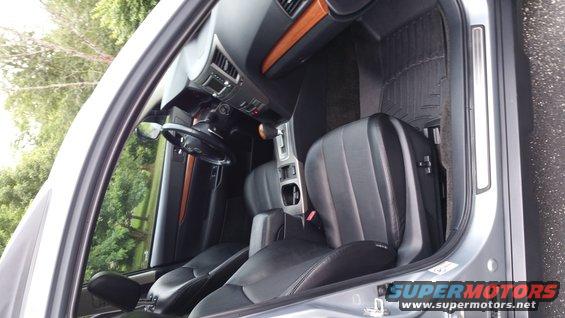 Interior view of a Subaru Outback showing front seats, dashboard, and center console