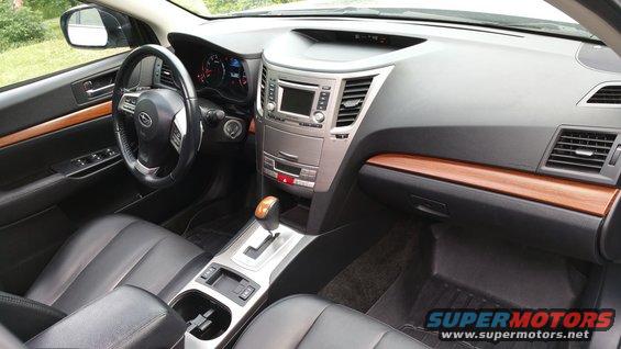 Interior of a 2014 Subaru Outback showing dashboard, steering wheel, and center console