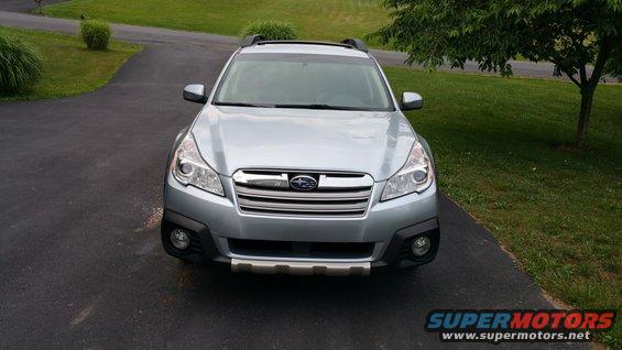 Silver 2014 Subaru Outback parked on a driveway