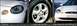 1997 Ford Taurus - This image shows the front of a white Ford Taurus, a close-up of its wheel, and the front grille.
