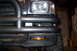 1993 Toyota Pickup/SR5 - Front view of a 1993 Toyota Pickup showing aftermarket bumper lights and brush guard.