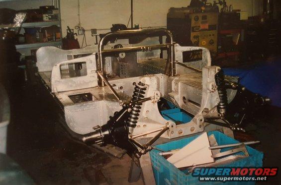 Aluminum chassis and suspension components in a workshop