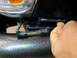 1993 Toyota Pickup/SR5 - A bubble level tool is used to check alignment on a vehicle part. The Supermotors.net logo is in the corner.