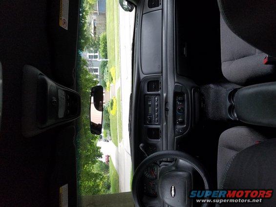 Interior of a 2004 Ford Crown Victoria showing dashboard, steering wheel, and seats