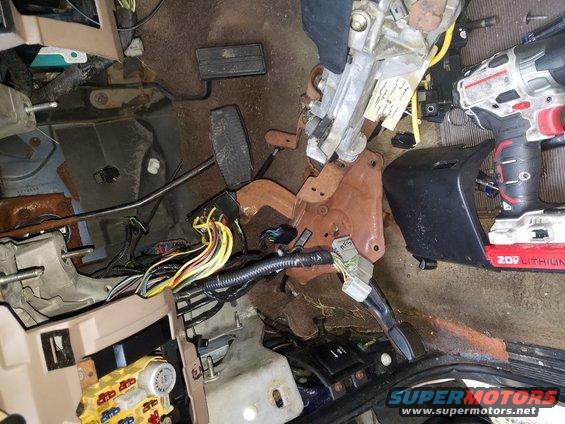 Interior dashboard wiring and pedals of a 1994 Ford Bronco