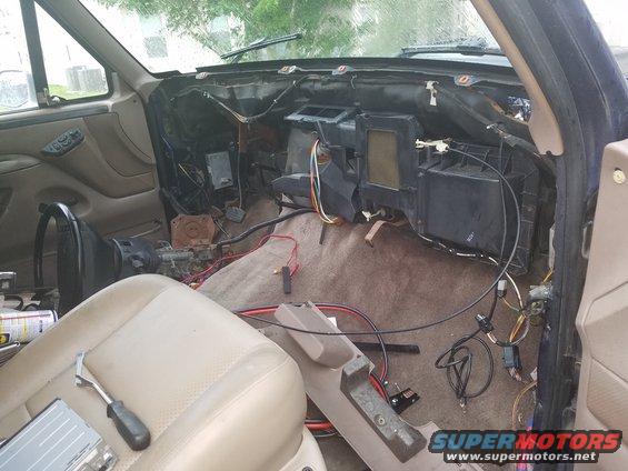 1994 Ford Bronco interior with dashboard removed, showing wiring and HVAC components