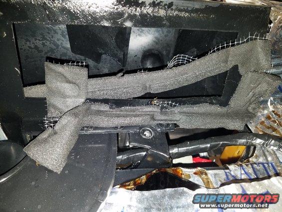 Dashboard interior with foam and mesh insulation, wires visible