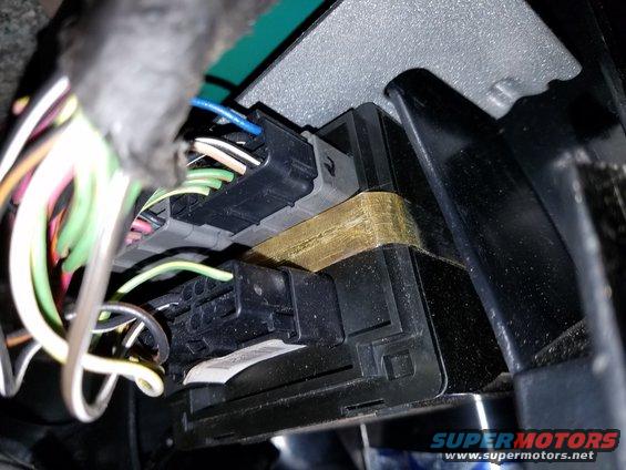Close-up of electrical connectors and wires inside a vehicle