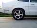 1978 Ford Mustang II - Rear side view of a white 1978 Ford Mustang II coupe with a chrome wheel.