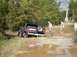 1989 Ford Bronco - This 1989 Ford Bronco is seen parked on a muddy dirt road, with its spare tire mounted on the rear.