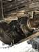 1989 Ford Bronco - A close-up view of a vehicle's suspension system, focusing on the leaf spring and axle components.