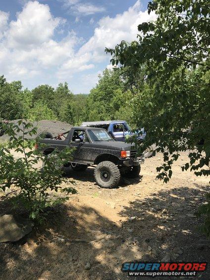 Black off-road SUV with large tires, seen from a 3/4 front angle