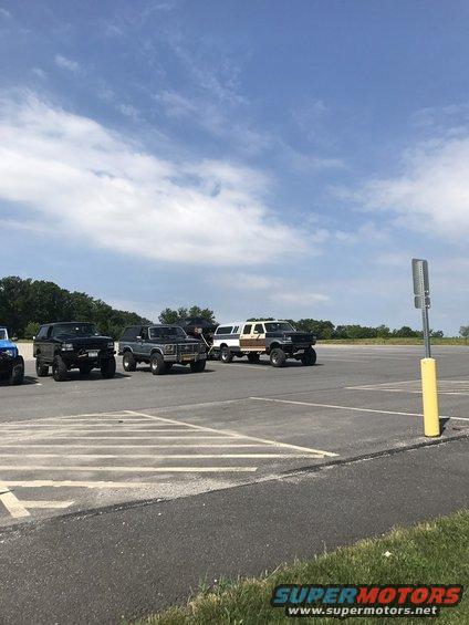Gray 1987 Ford Bronco parked in a lot with other trucks and SUVs