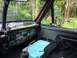 1989 Ford Bronco - Interior view of a 1989 Ford Bronco, dashboard adorned with numerous stickers.