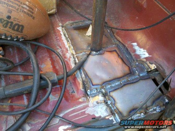 Welded floor pan with a football and cables