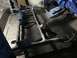 1989 Ford Bronco - Undercarriage of a vehicle being treated with protective coating during restoration.