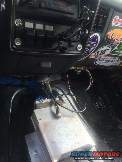 Interior view of dashboard with aftermarket electronics and wiring
