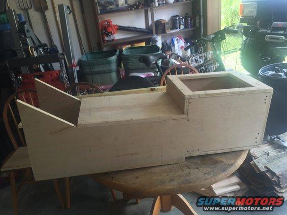 Wooden center console under construction on a table