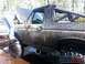 1989 Ford Bronco - This heavily modified SUV, likely a Ford Bronco from the late 1980s, is covered in mud after off-roading.