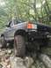 1989 Ford Bronco - This modified 1989 Ford Bronco is navigating a rocky trail.