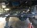 1989 Ford Bronco - Underneath view of the front axle and steering system of a 1989 Ford Bronco.