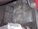 2007 Ford Mustang - The interior floor is covered with a protective plastic sheet that has text indicating it should be removed by the dealer.