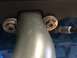 1989 Ford Bronco - A close-up view of engine components, including a spark plug and mounting hardware.