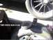 1909 Ford Model T - A close-up shows a disassembled hub and a tire with visible text and a date stamp.