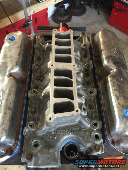 Ford engine intake manifold with valve covers attached, viewed from above