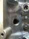 1989 Ford Bronco - This is a close-up view of a cast iron engine block, showing machined surfaces and casting marks.