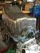 1989 Ford Bronco - Close-up view of an engine oil pan with a blue gasket installed.
