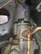 1989 Ford Bronco - Close-up view of a greasy steering gear assembly, possibly from an older vehicle.