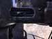 1989 Ford Bronco - Close-up of a modified vehicle frame in the engine bay, showing a cut-out section.