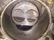 1989 Ford Bronco - Close-up view inside an engine cylinder, revealing the piston and a .040 measurement marking.
