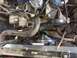 1989 Ford Bronco - The engine bay features a radiator, fan, and various engine components, including the alternator and belts.