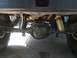 1989 Ford Bronco - Underside view of a 1989 Ford Bronco, highlighting the rear axle, leaf springs, and exhaust components.