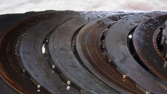 Clutch plates with visible wear and oil