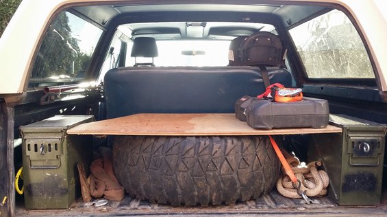 Spare tire and gear stored in back of SUV