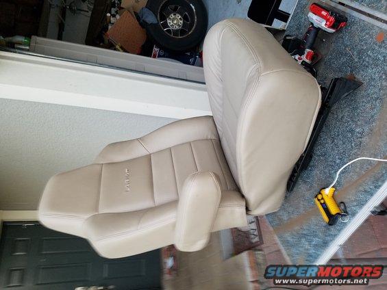 Tan leather car seats with 'Lariat' embossed on the side