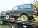 1989 Ford Bronco - This 1989 Ford Bronco is being transported on a flatbed tow truck.
